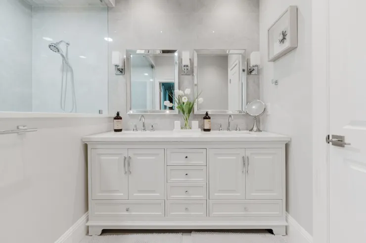 White vanity and large mirror